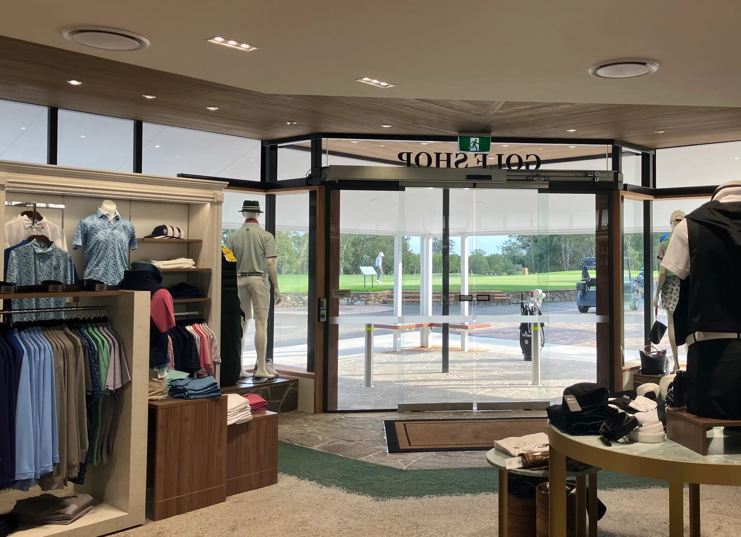 The shop floor looking out through the entry doors to the course.