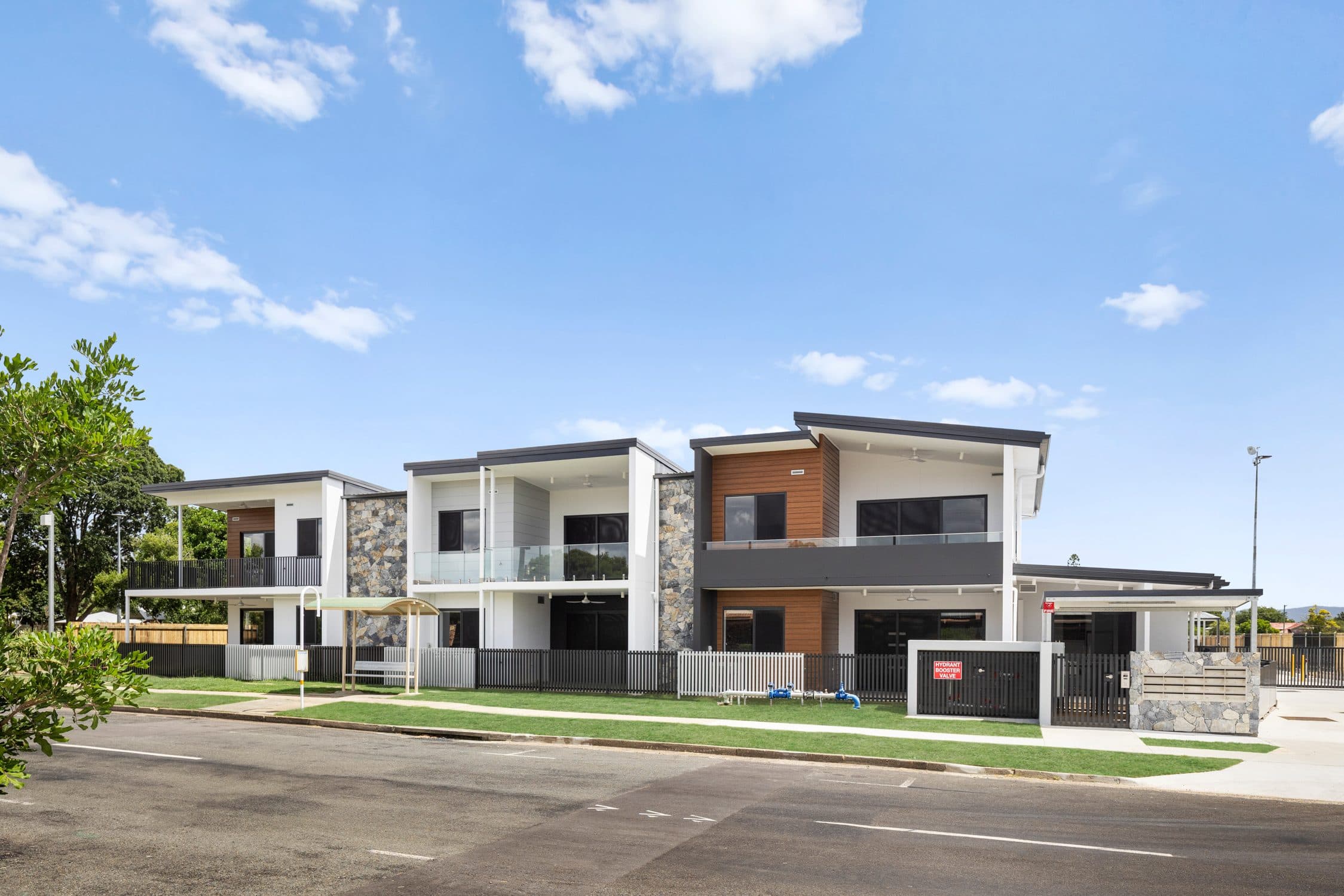 The two-storey care buildings on Joyce Street with their landscaped frontage.