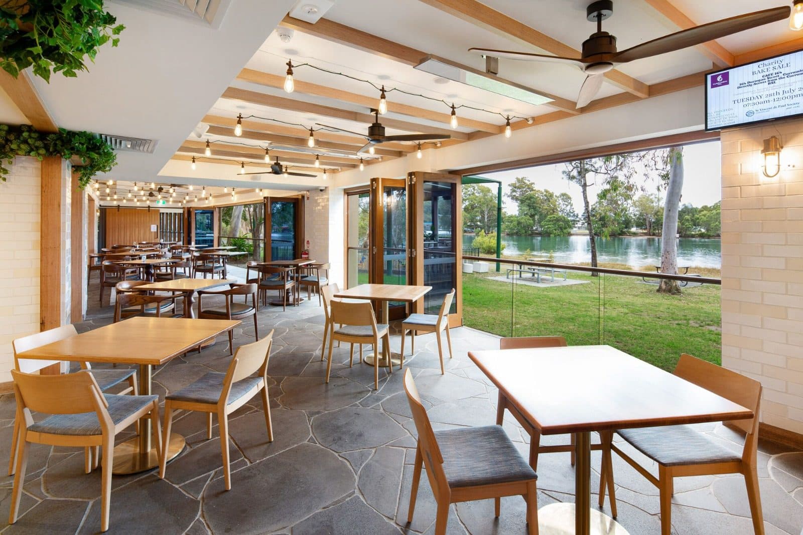 Dining by the windows with views to the creek.