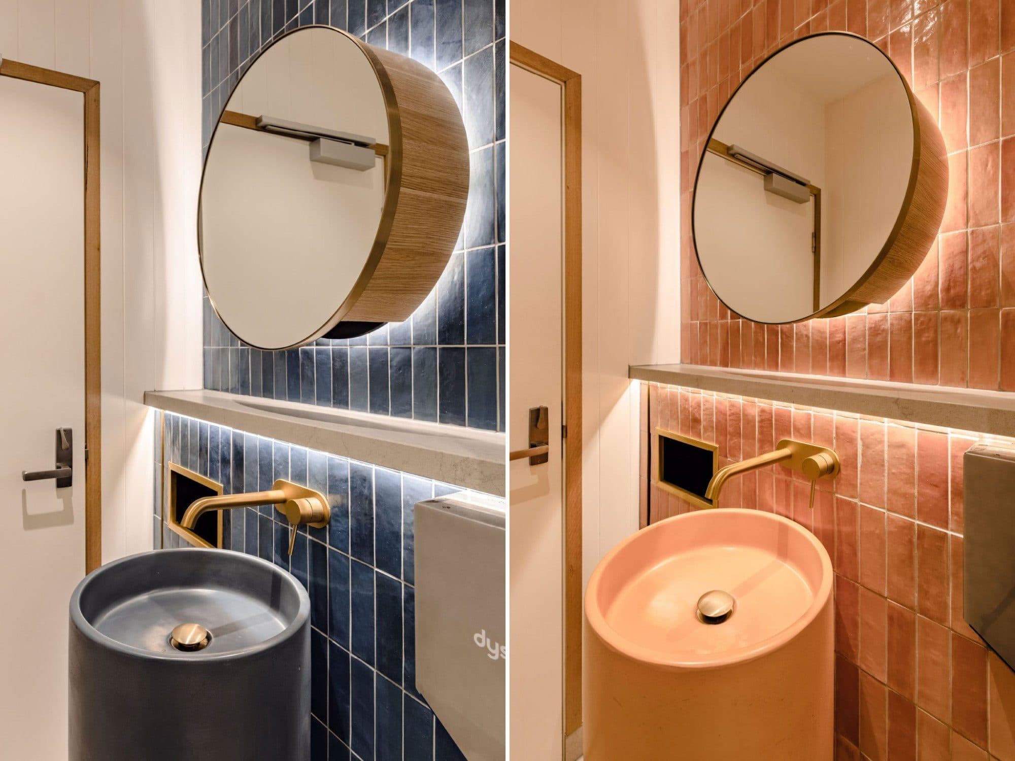 Amenities beside the gaming room, with round mirrors, brass tapware and terracotta tile.