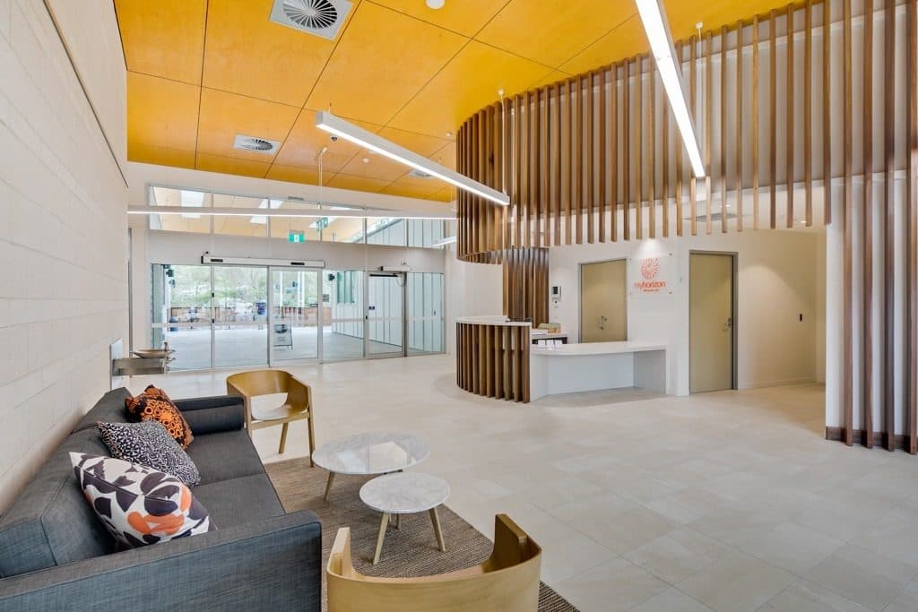 The reception and waiting area under a timber ceiling.