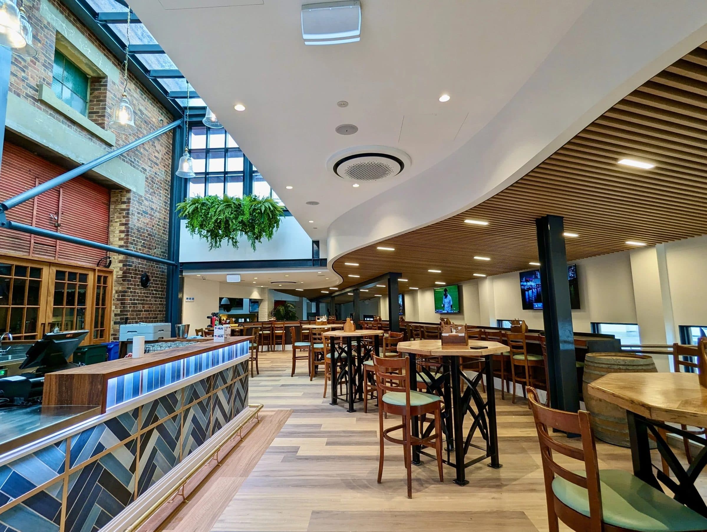 The new glass atrium bar beside the conserved tramway substation.