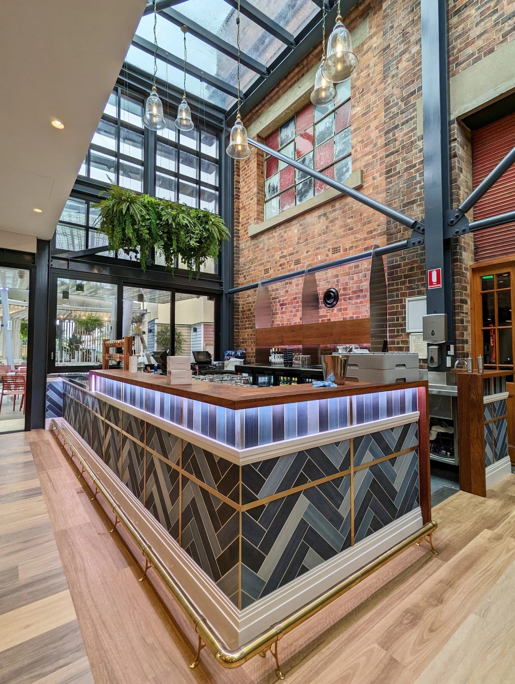The atrium bar with the substation's heritage brickwork behind.
