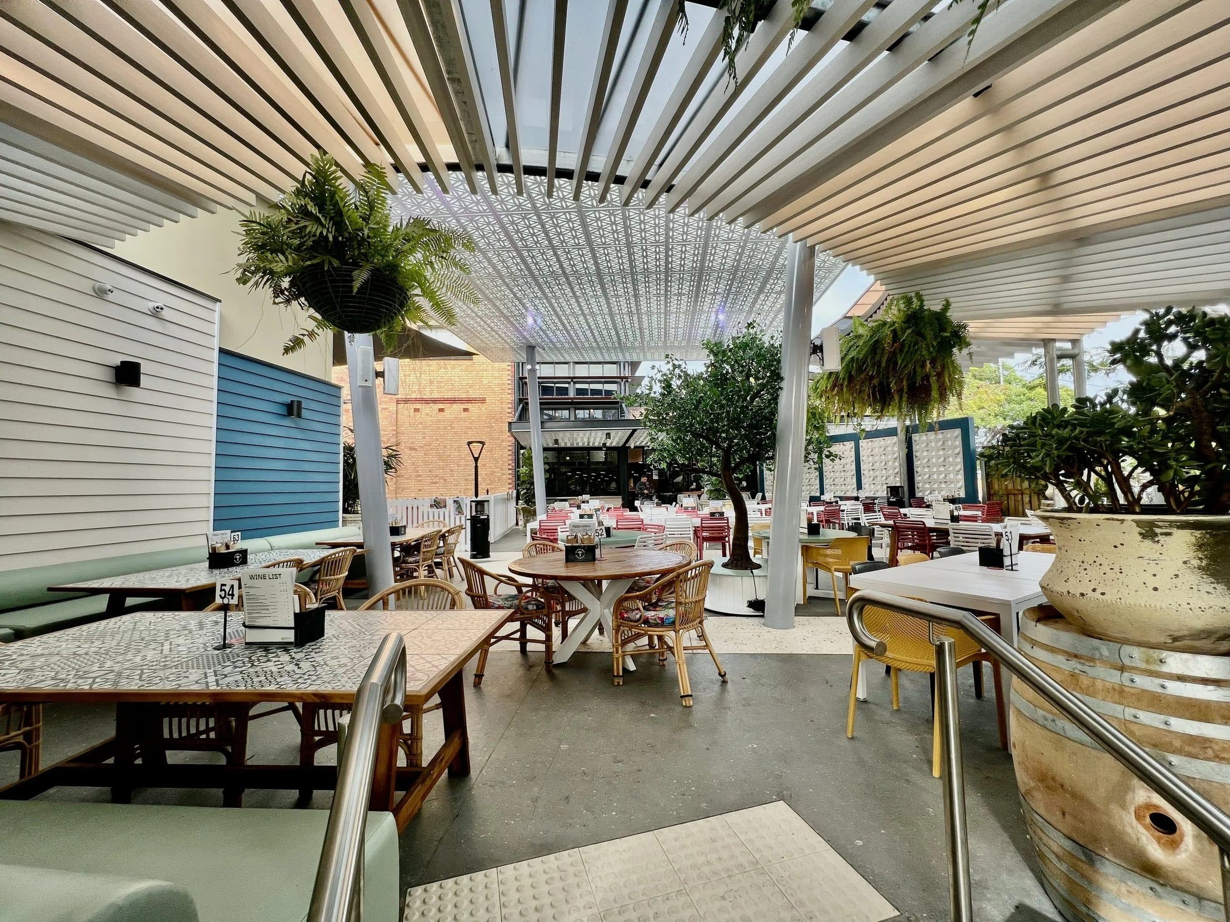 Courtyard tables and planters in the new outdoor dining space.