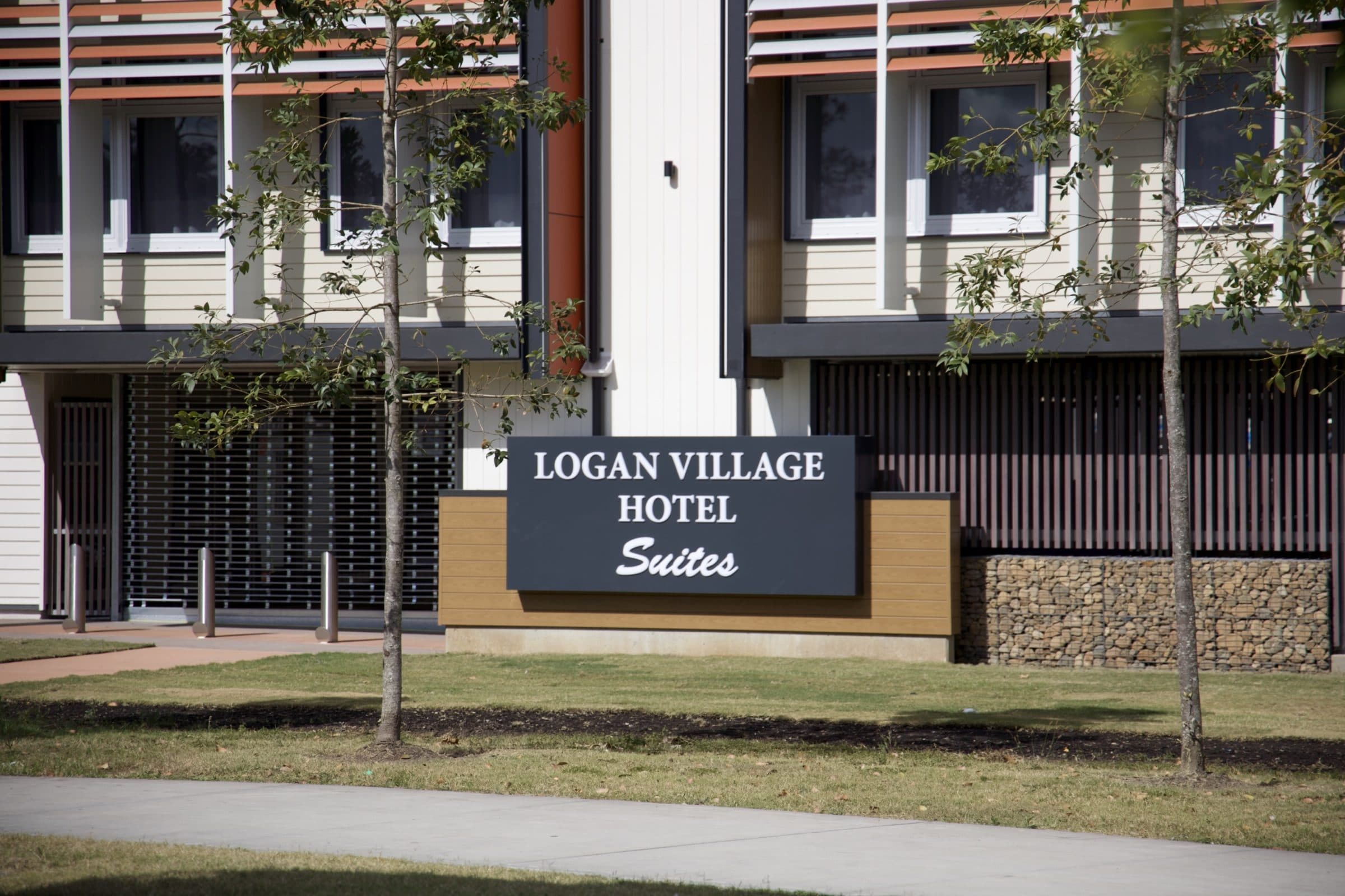 The motel entry and sign seen from the street.