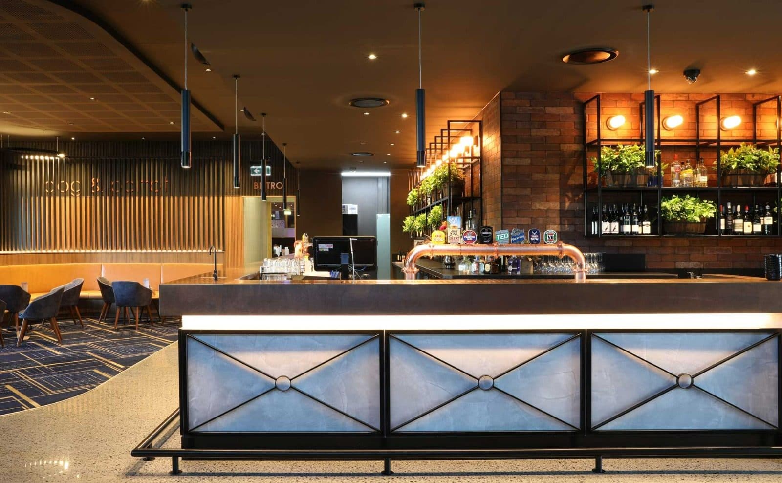 The sports bar servery with lit joinery.