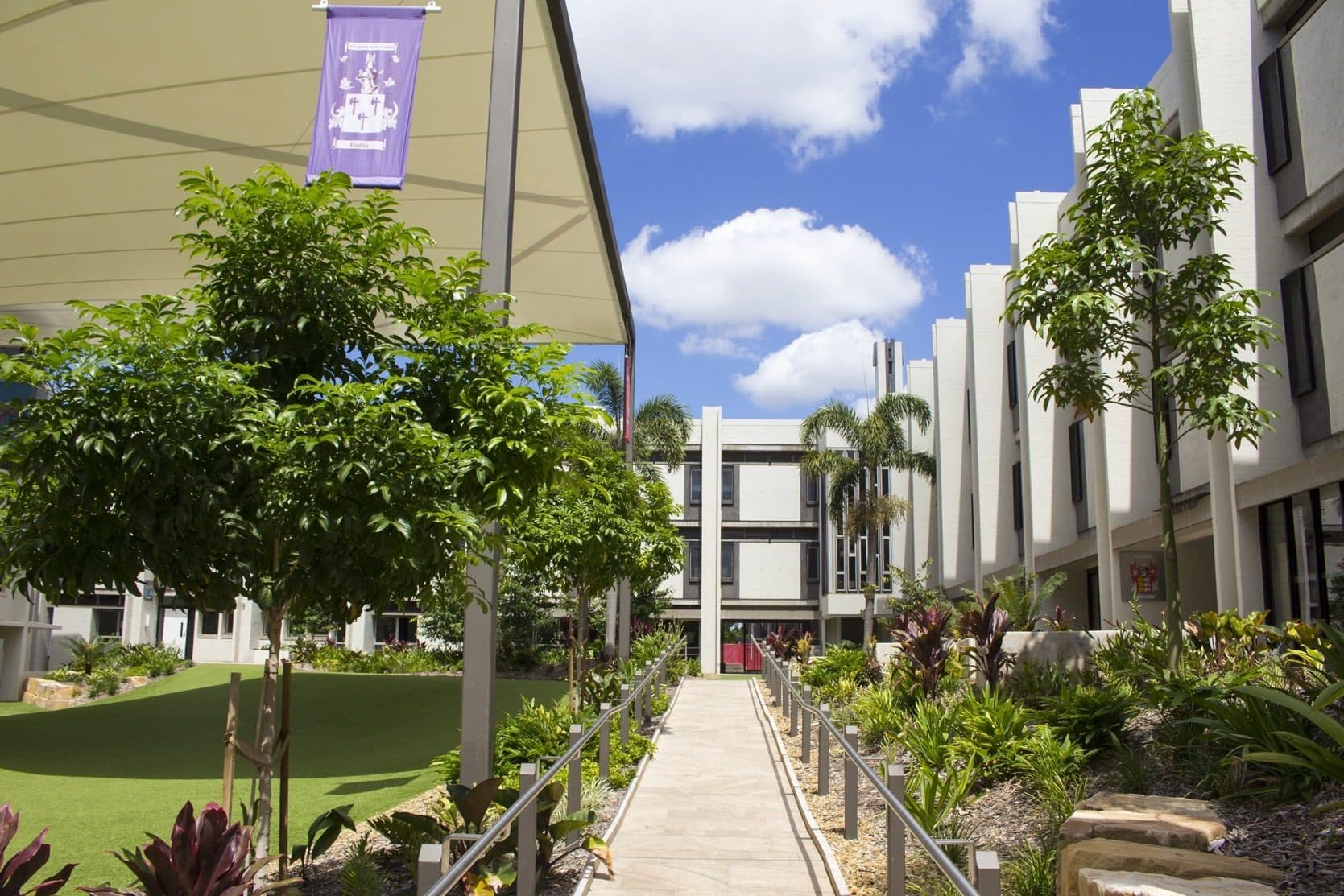 A planted path through the courtyard between the boarding wings.