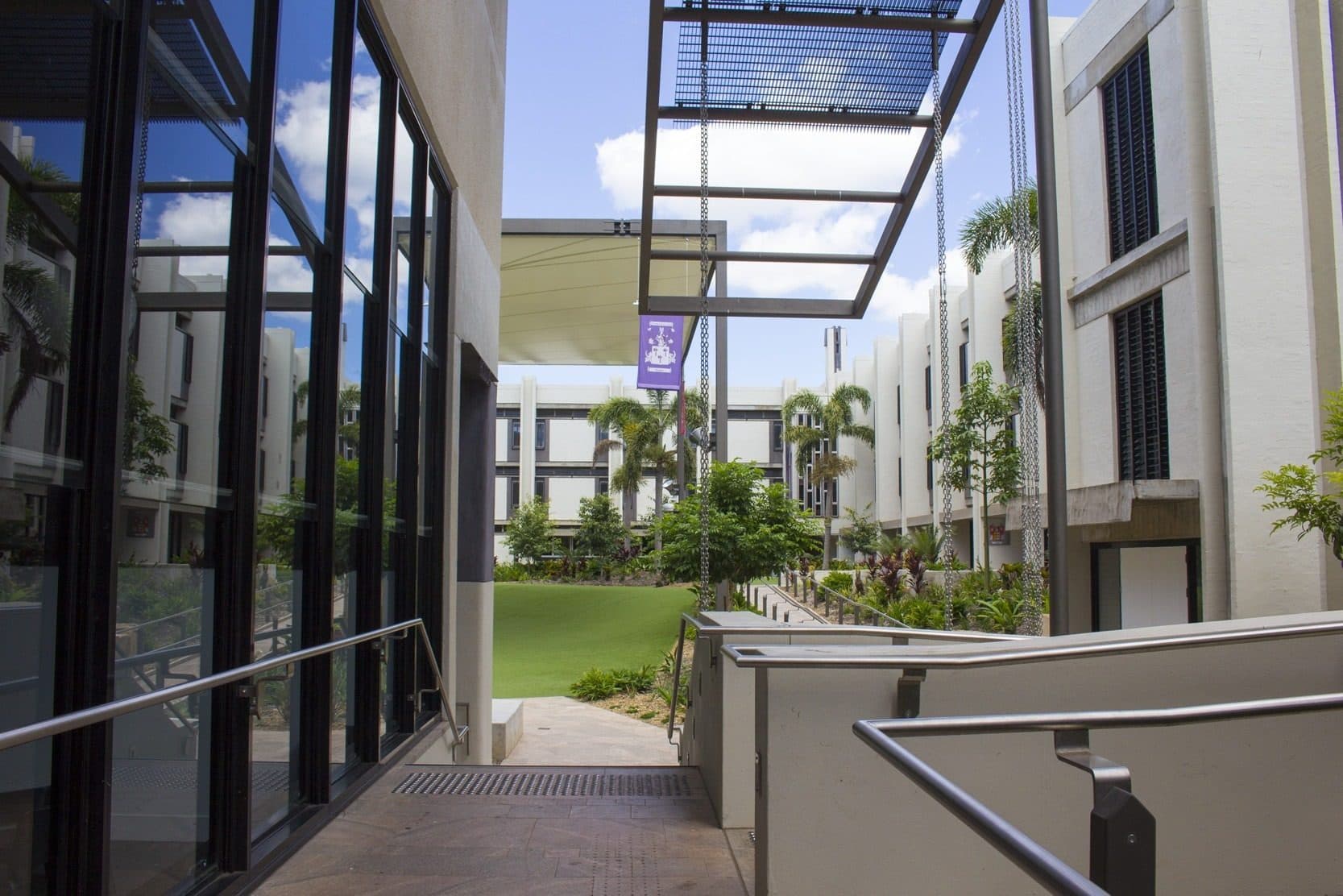 The glazed walkway looking out to the landscaped courtyard.