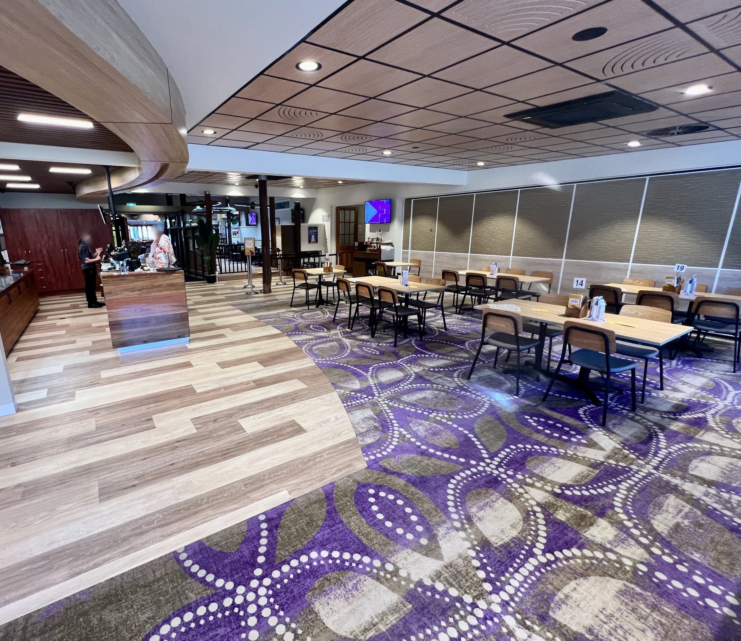 The function and dining area with new flooring and timber ceiling.